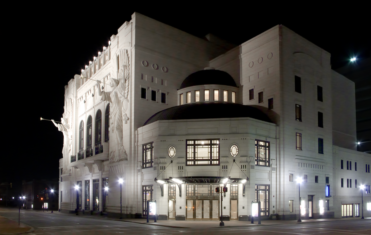 Large architectural building at night with illuminated facade. Bass Hall